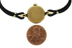 18K gold BULOVA M7 ladies wrist watch on silk cord.