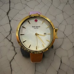 Kate Spade white mother-of-pearl dial signature pink spade twelve o’clock marker