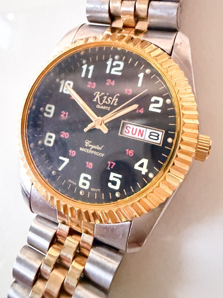 Super Clean Men’s Kish watch black face, gold bezel, two tone band – Rare Find!