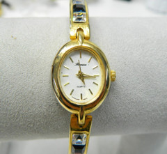 Beautiful Gold tone and blue and clear stone accented lady’s wristwatch/watch