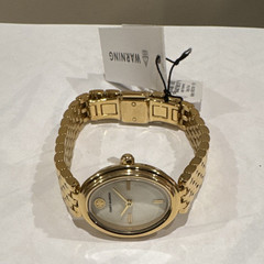 Tory Burch Women’s Quartz Dress Watch Oval White Dial Gold Tone Bracelet 30m