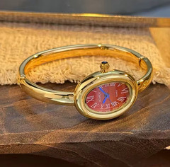HOWDY Quartz Oval Bangle Wristwatch Roman Numerals Gold/Silver Tone Women’s