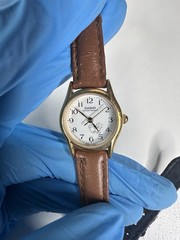 Casio LTP-1094 Vintage Womens Watch Dog Sketch Dial Gold Tone Case Leather Strap