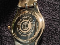 Cyma le Locle Men’s Sapphire Crystal Watch. Stainless Steel And 18k Gold Bezel