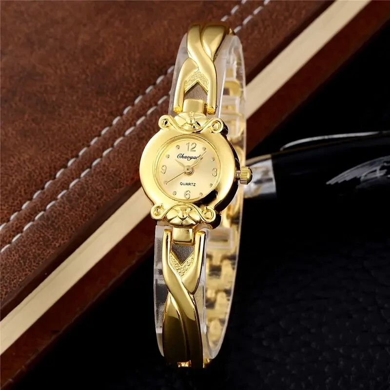 Reloj de pulsera de cuarzo para mujer, correa de acero inoxidable en tono dorado