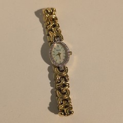 Bulova Quartz Women’s Oval White Dial Diamond Accent Gold Tone Bracelet Watch