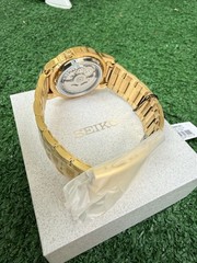 Seiko 5 Men’s Automatic Gold Tone Black Dial Exhibition Box Booklet