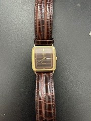 1986 Alba-Seiko Watch – Arabic/English dates. Brown face with brown leather band