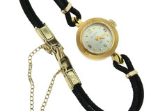18K gold BULOVA M7 ladies wrist watch on silk cord.