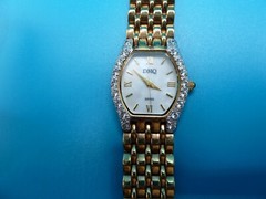 DMQ Watch Swiss Movement Crystals Gold Tone Bezel Stainless DQ 4018-19