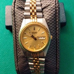 Seiko Quartz Ladies Date Two-Tone Gold Sunburst Dial Bracelet Watch