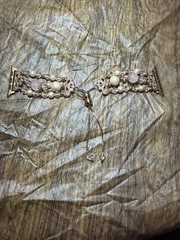 pink beaded crystal Apple Watch band a rose gold-tone adjustable bolo clasp.