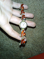 Women’s Gold Tone Analog Wristwatch Gold/Orange Bracelet White Dial Arabic