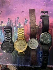 4 Nixon Watches!! Gold , Black , Brown , Green !
