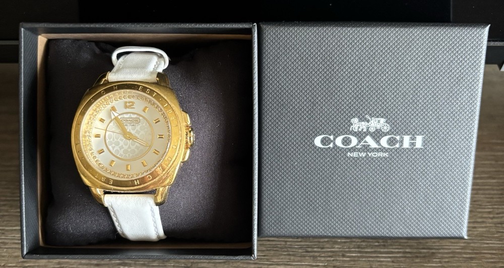 COACH 14503150 Boyfriend, White DeBeer’s Leather band, Gold face, Women’s Watch