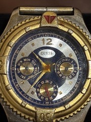 VINTAGE GUESS WATCH HEAVY CASE BEZEL- QUARTZ – RUNS GREAT – BBA-27