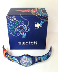 SWATCH SWISS MADE SO28Z125 MODEL DRAGON IN WAVES, BAND AND FACE INTERTWINE NIB