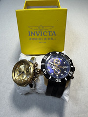 Invicta Men’s/Women’s 2 Watch Lot Chronograph Quartz Blue/Gold Dials Black.