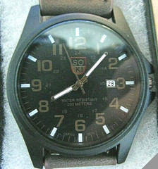 SOKI Men’s Date watch with battery powered quartz movement and Leather bracelet.