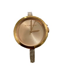 Michael Kors watch a rose gold-tone finish with pavé crystals on bangle strap.