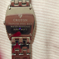 Description: Elegant Croton women’s silver-tone watch featuring a sparkling crys