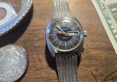 Caravelle Automatic Men’s Day/Date Black Dial Silver Case Mesh Bracelet Watch