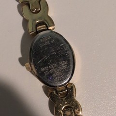 Bulova Quartz Women’s Oval White Dial Diamond Accent Gold Tone Bracelet Watch