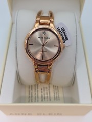 Anne Klein Women’s AK/2626RGRG Diamond-Accented Dial Rose Gold-Tone Open Bang…