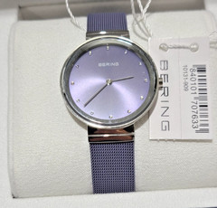 Bering Classic Silver Case and Lavender Strap Women’s Watch. 10131-909