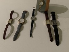 collection of used timex, puegot, carriage watches