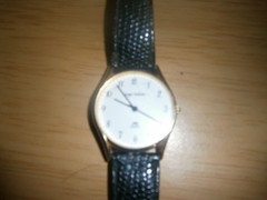 Early 2000’s black leather ‘Sergio Valente’ quartz unisex watch. 24cm.(E22a1)