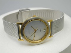 SKAGEN TWO TONE T MADE IN DENMARK RUNS GREAT, CRYSTAL FLAWED AS PICTURED.