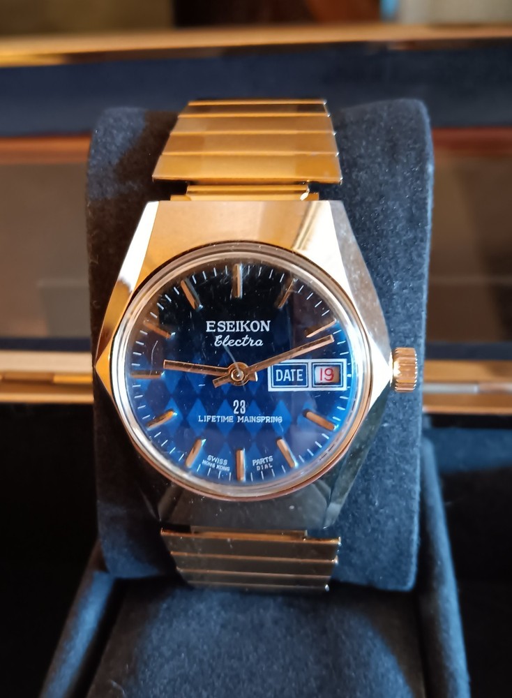 Vintage Gold SEIKON Electra Mechanical Blue Dial Faceted Crystal 36mm Watch
