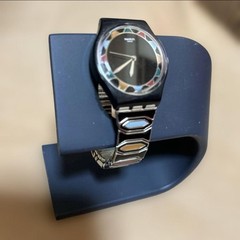 Swatch watch with black dial and multicolor bezel