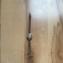 Gold And Black Watch With Roman Numerals