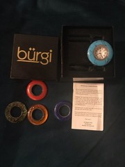 Burgi women’s watch with silver open bangle band and 5 interchangeable bezels