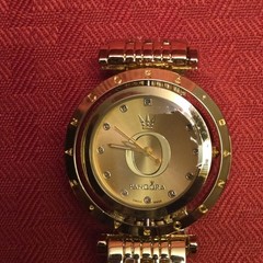 Pandora gold-tone watch in excellent condition. Includes original box.