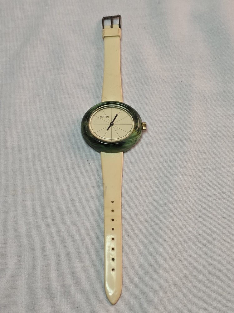 vintage 1970s Sutton Swiss-made manual-wind watch with a green marbled…