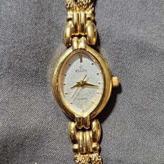 Elgin EL350-007 Women’s Quartz Gold Tone Bracelet Oval White Dial Stick/Dot