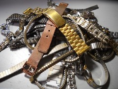 1054L Watch bands 27 piece gold color or plated ? stratch and regular look it