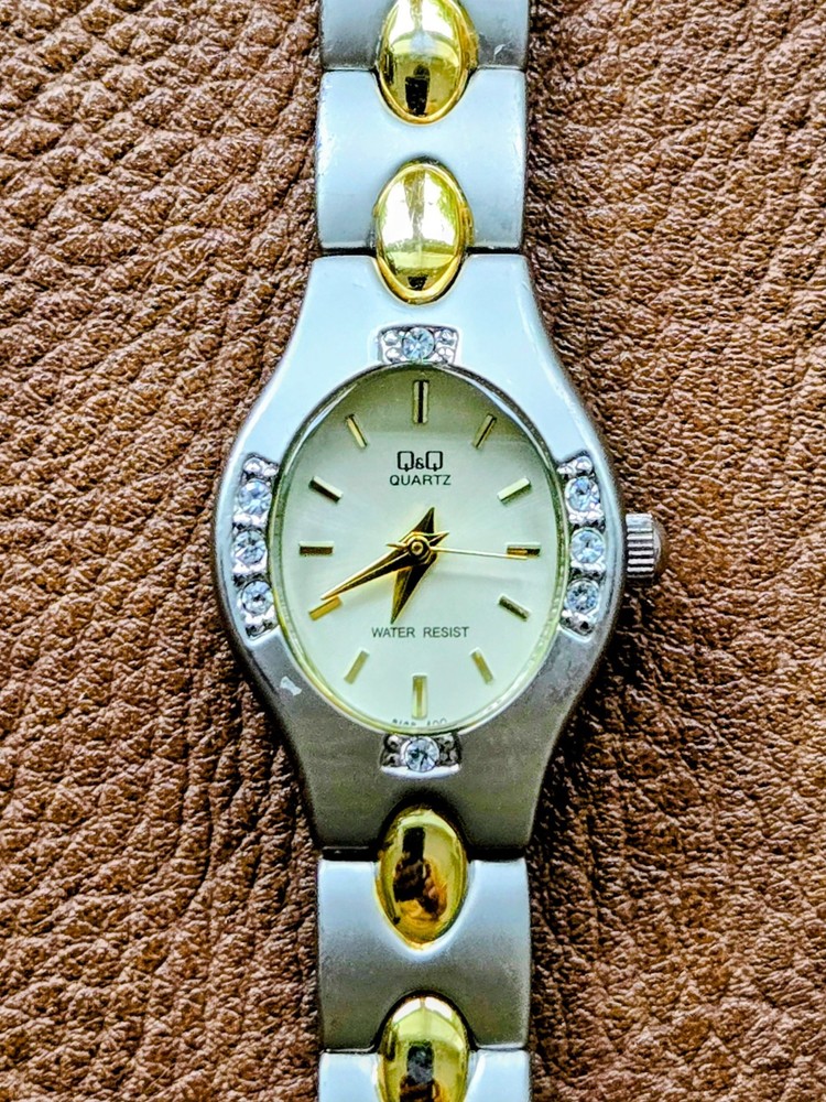 Q&Q (by Citizen) Women’s Watch Two Tone Silver With Gold Accents Bracelet