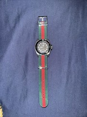 100% Authentic ￼Gucci Dive Black Men’s Watch with green/red strap.